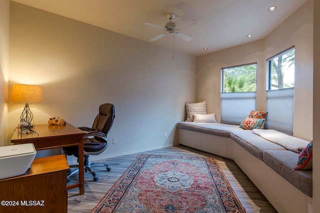 home office with ceiling fan and light wood-type flooring