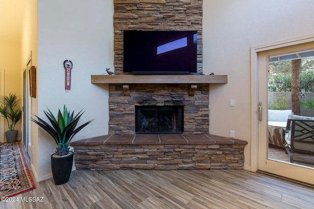 living room featuring a fireplace and hardwood / wood-style floors