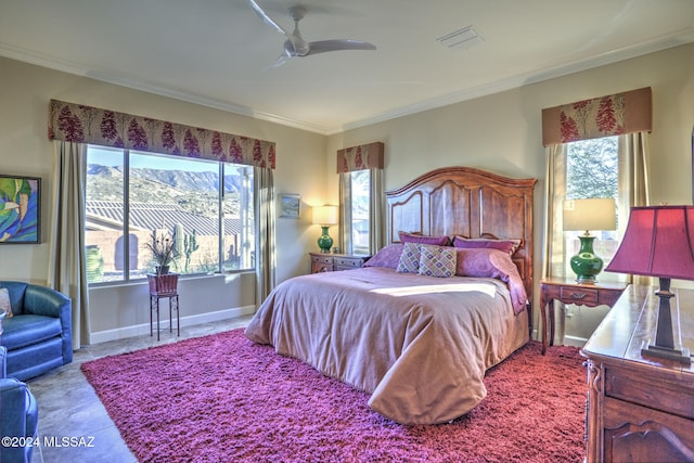 tiled bedroom featuring a mountain view, ceiling fan, and ornamental molding