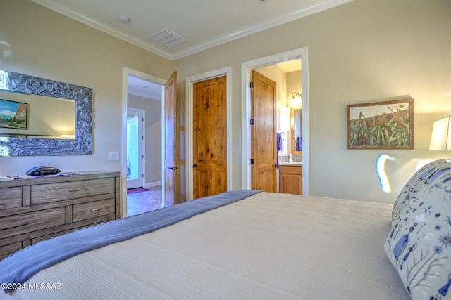 bedroom featuring ensuite bathroom and crown molding