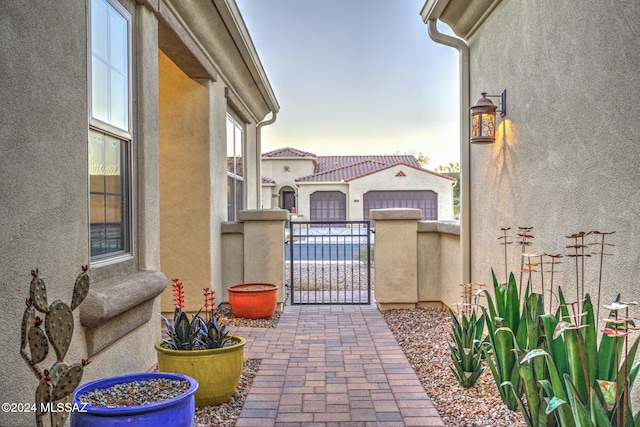 patio terrace at dusk with a garage