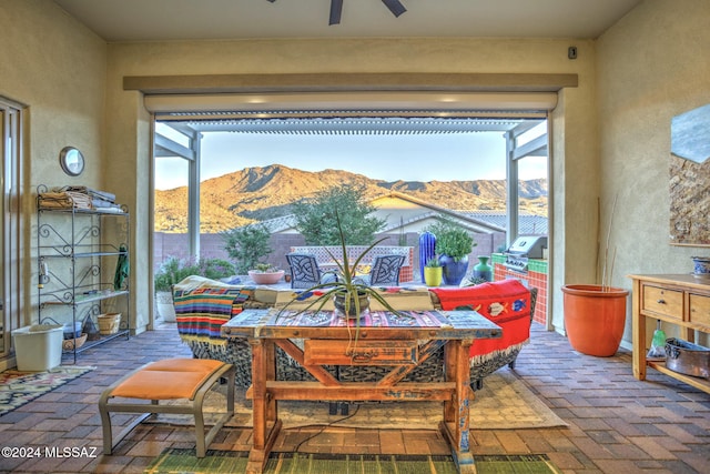 interior space featuring a mountain view and ceiling fan