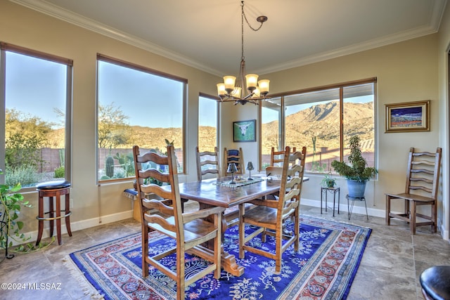 dining space featuring a notable chandelier, a mountain view, and ornamental molding