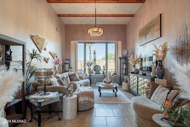 tiled living room featuring beamed ceiling, visible vents, and an inviting chandelier