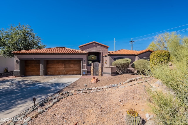 mediterranean / spanish house featuring a garage