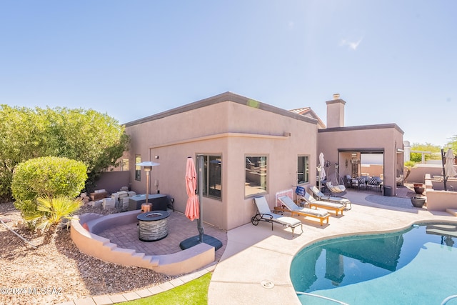 rear view of house featuring a patio