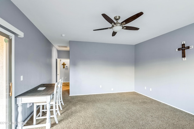 spare room featuring carpet and ceiling fan