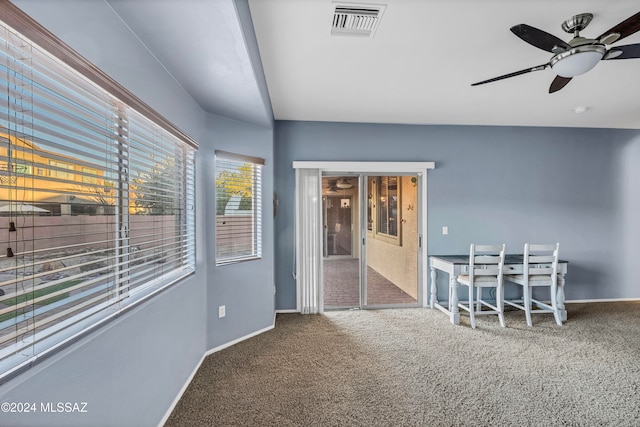 sunroom featuring ceiling fan