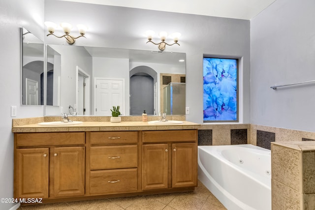 bathroom featuring shower with separate bathtub and vanity