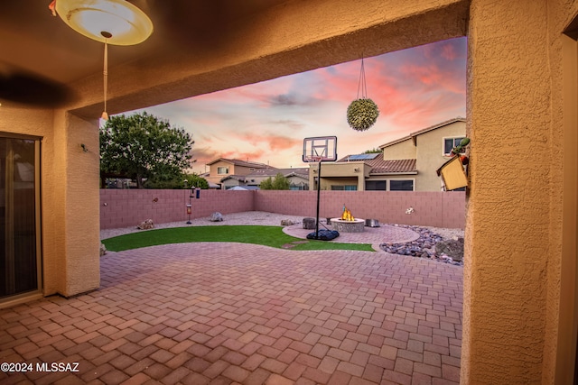 view of patio terrace at dusk