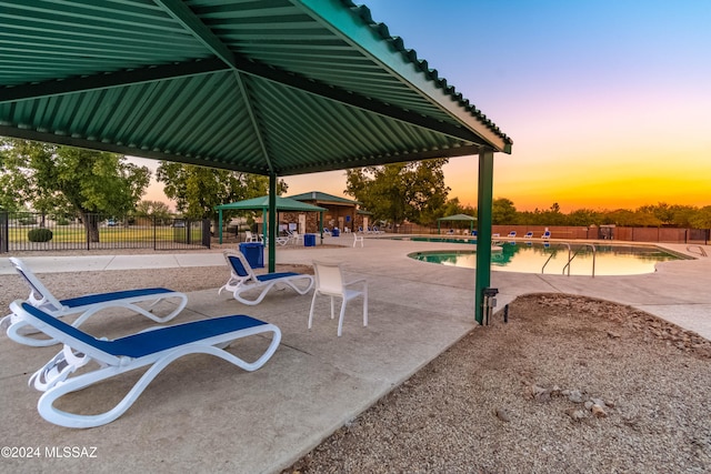 exterior space featuring a gazebo, a swimming pool, and a patio