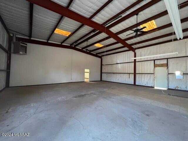 garage featuring a wall mounted air conditioner