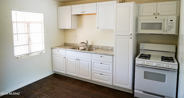 kitchen with white cabinetry, dark hardwood / wood-style flooring, sink, and white appliances