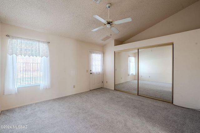 unfurnished bedroom featuring light carpet, ceiling fan, and a closet