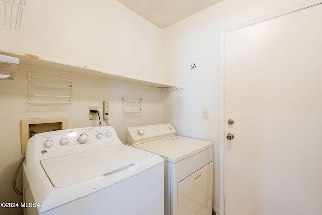 laundry room with washing machine and clothes dryer