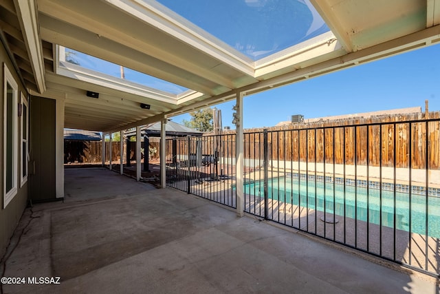 view of patio featuring a fenced in pool