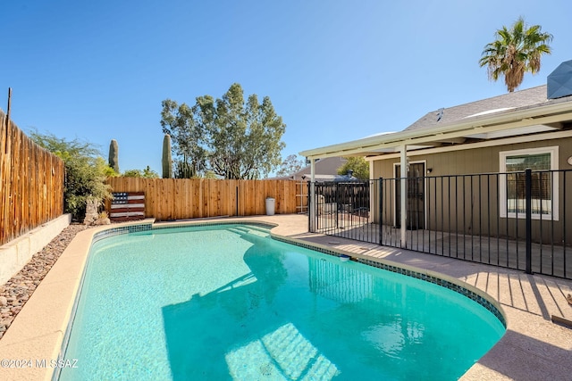 view of swimming pool with a patio