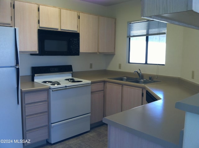 kitchen featuring light tile patterned flooring, light brown cabinetry, white appliances, and sink