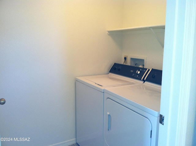 washroom with independent washer and dryer