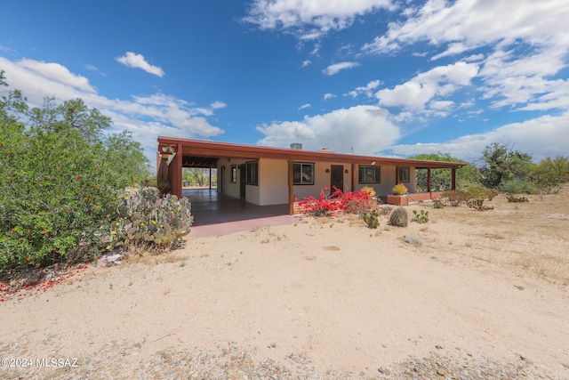 view of front of house with a carport