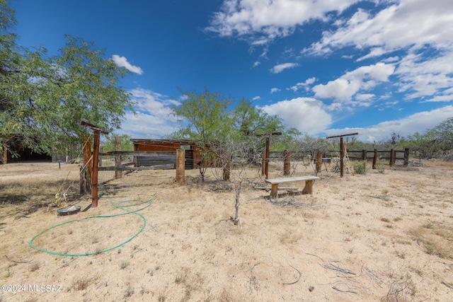 view of yard with a rural view