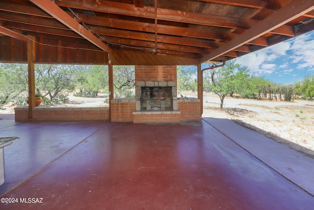 view of patio / terrace with an outdoor stone fireplace