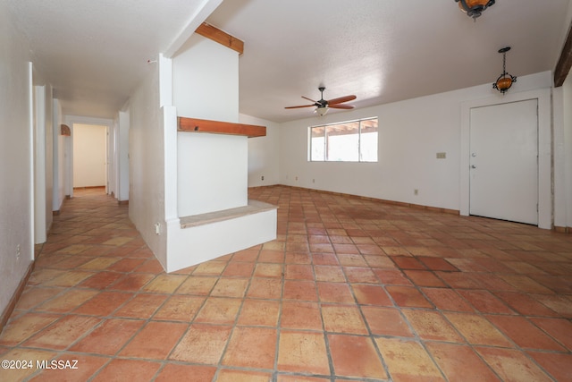 unfurnished room featuring ceiling fan