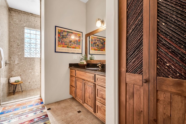 bathroom featuring tile patterned flooring and vanity