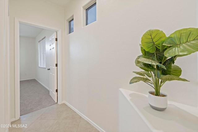 hallway featuring light tile patterned floors