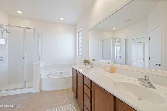 bathroom featuring vanity, tile patterned floors, and separate shower and tub