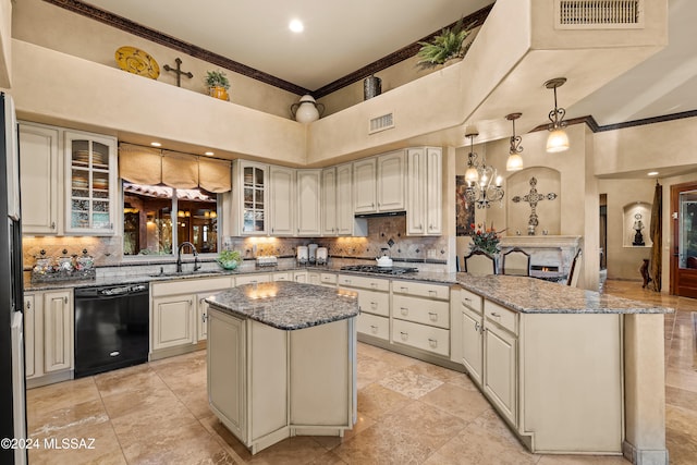 kitchen with a high ceiling, dark stone countertops, decorative light fixtures, a kitchen island, and black dishwasher