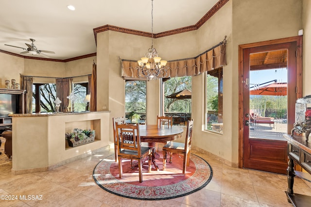 tiled dining space with ceiling fan with notable chandelier and crown molding