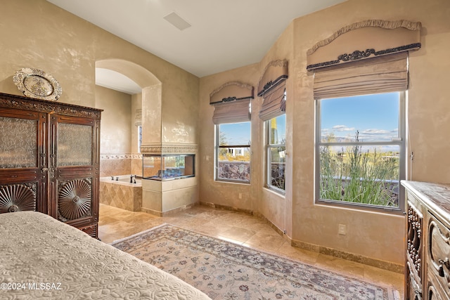 interior space with plenty of natural light and a relaxing tiled tub