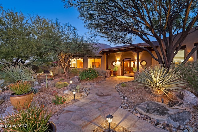 view of front facade with a patio area