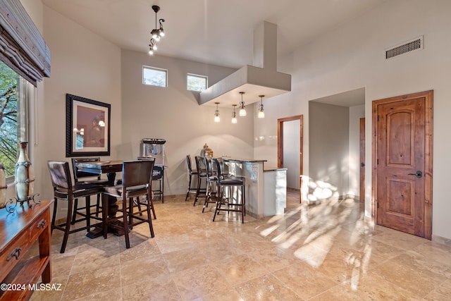 dining area with a high ceiling