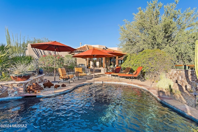 view of swimming pool featuring a patio area