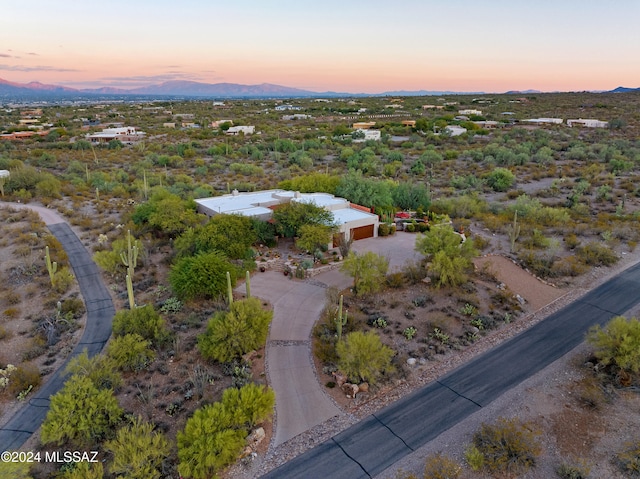 aerial view at dusk with a mountain view