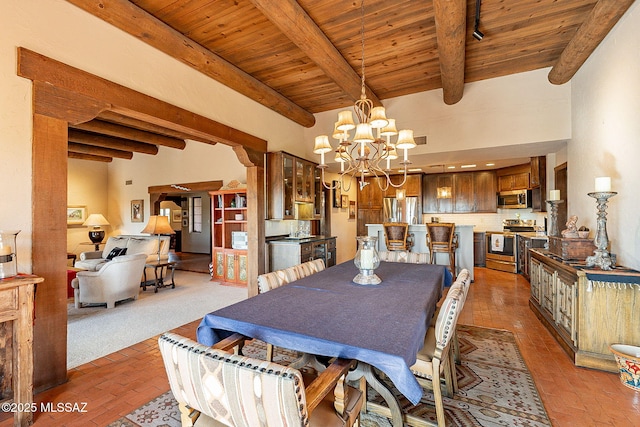 dining room with beamed ceiling, wooden ceiling, and an inviting chandelier