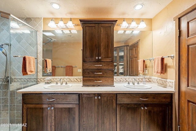 bathroom featuring backsplash, vanity, and walk in shower