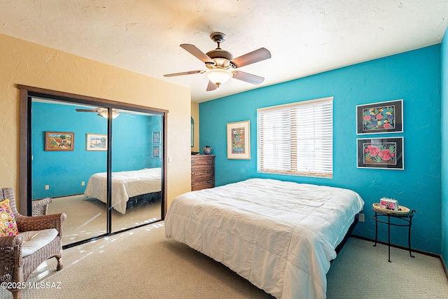 bedroom featuring carpet flooring, ceiling fan, and a closet