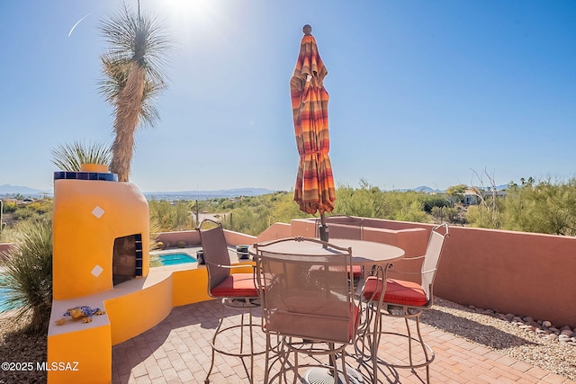 view of patio / terrace featuring a mountain view