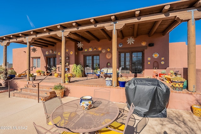 view of patio with a grill