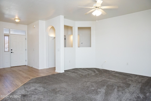 spare room featuring ceiling fan and wood-type flooring