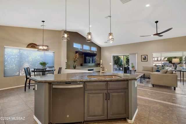 kitchen with a kitchen island with sink, dishwasher, hanging light fixtures, and sink