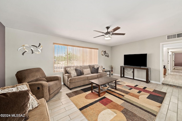 living room featuring ceiling fan