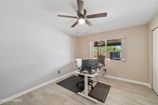 workout area featuring ceiling fan