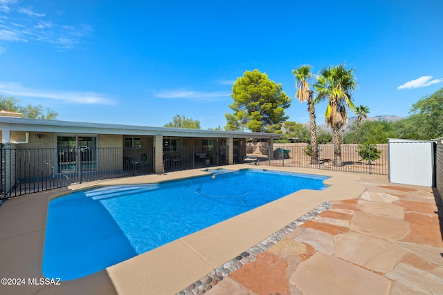 view of swimming pool featuring a patio