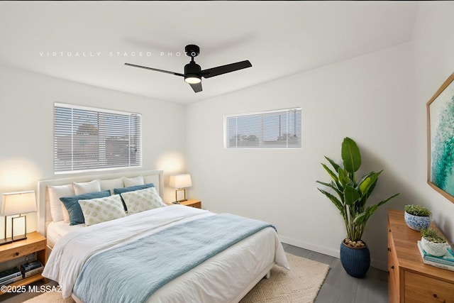 bedroom featuring ceiling fan and hardwood / wood-style flooring