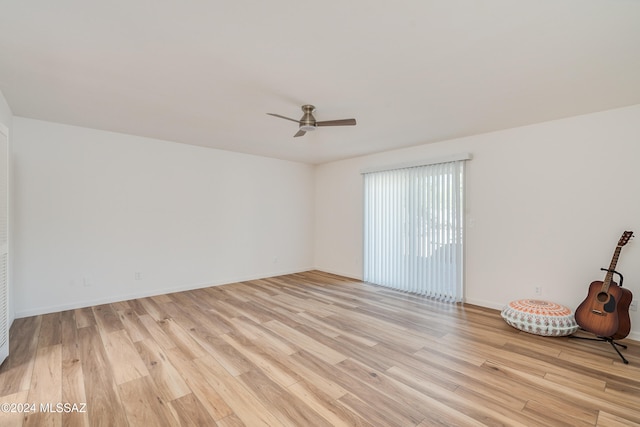 unfurnished room featuring light wood-type flooring and ceiling fan