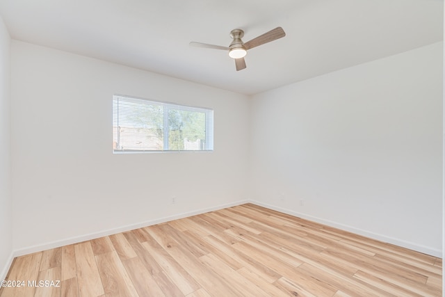 empty room featuring ceiling fan and light hardwood / wood-style floors